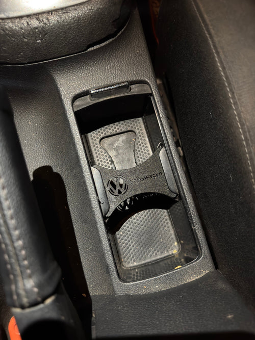 Volkswagen cup holder insert fitted in the centre console