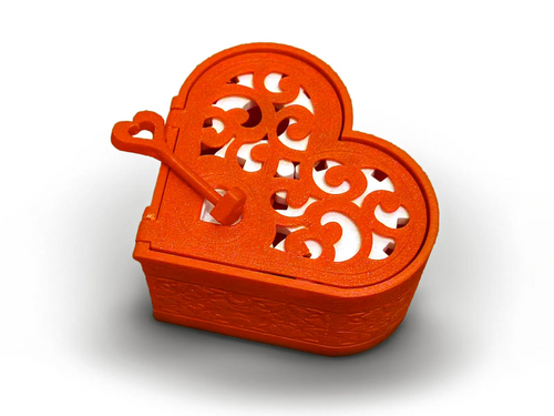 Red heart lock box with its key in the lid
