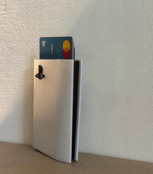PS5 card holder standing against a wall
