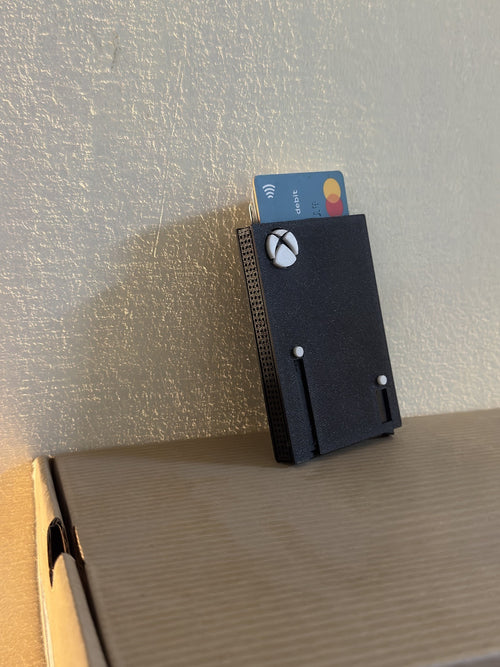 Xbox card holder from the side, showing the vented edge