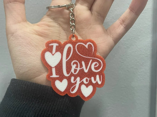 I Love You keychain held in a hand